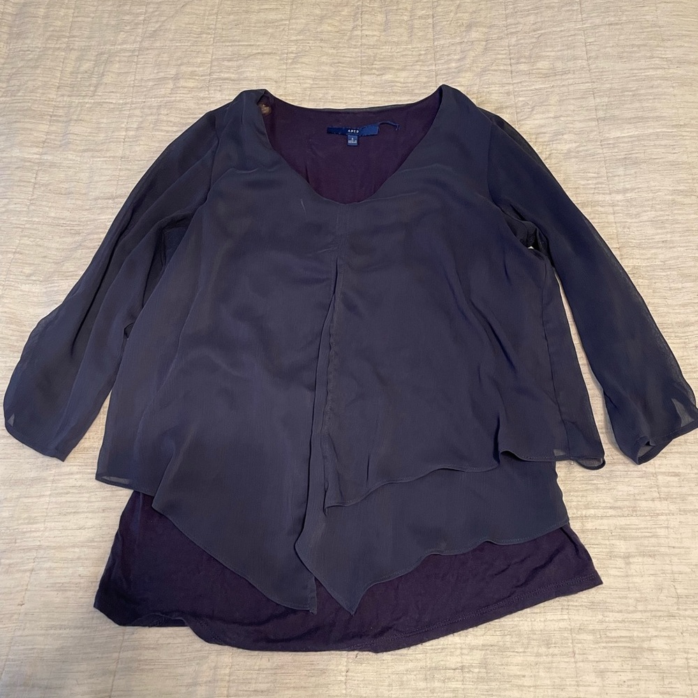 Blue blouse, slightly worn.